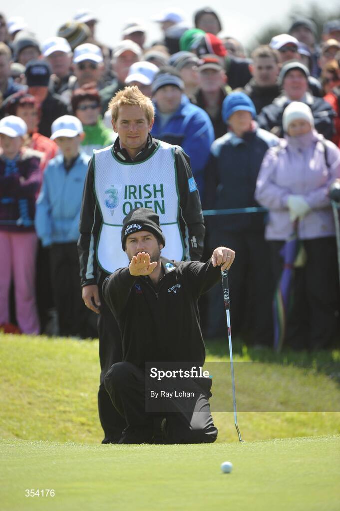 17 May 2009; England's Robert Rock lines up a putt on the 9th, with his caddie Jamie Lane, during the 3 Irish Open Golf Championship. County Louth Golf Club, Baltray, Co. Louth. Picture credit: Ray Lohan / SPORTSFILE