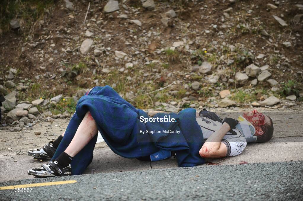 20 May 2009; John Veness, Surrey Racing League, lies injured after crashing on the descent of the Conor Pass climb. FBD Insurance Ras 2009, Stage 4, Cahirciveen to Killorglin. Picture credit: Stephen McCarthy / SPORTSFILE