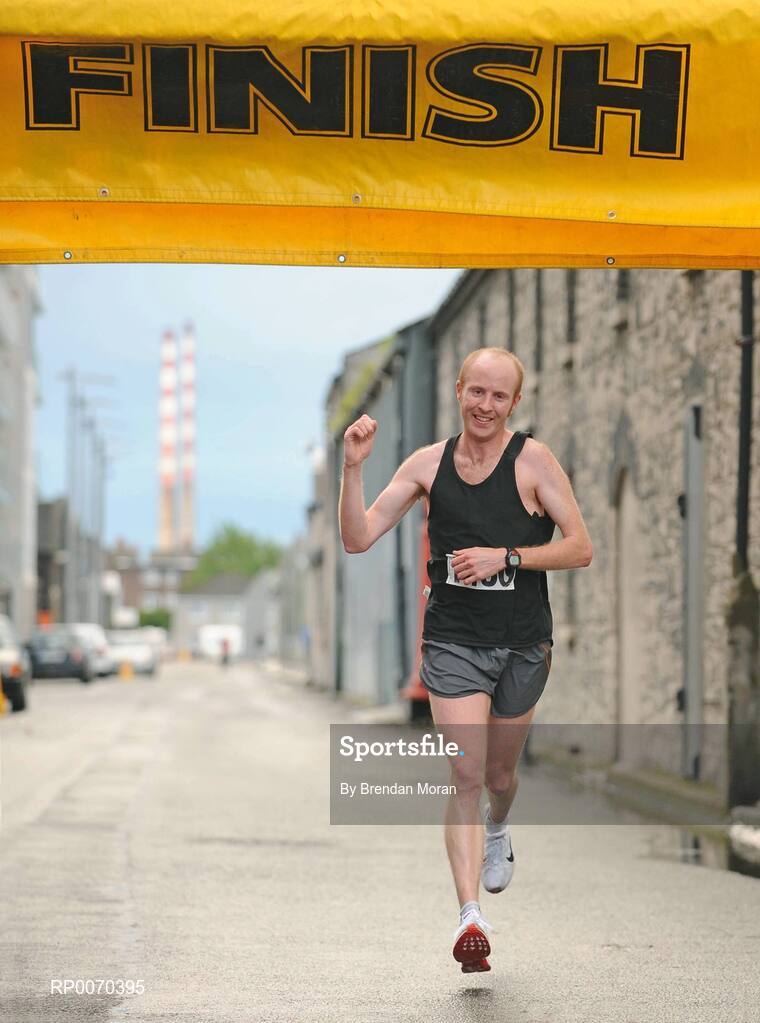19 May 2009; Paul O'Connell, from Dublin, comes home to win the Docklands Fun Run in a time of 25 minutes and 51 seconds. Close to 2,500 walkers, joggers and runners of all abilities took part in the annual Docklands Fun Run over 8km this evening. An estimated €12,000 was raised for designated charity, Irish Autism Action. Caitriona Jennings was the first woman home, in a time of 30 minutes and 02 seconds. Docklands Grand Canal Square, Dublin. Picture credit: Brendan Moran / SPORTSFILE
