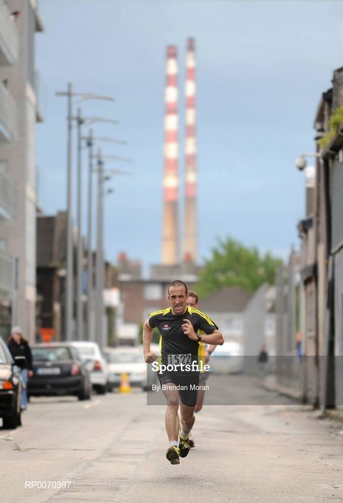 19 May 2009; Peter Mooney comes home in second place in the Docklands Fun Run in a time of 27 minutes and 50 seconds. Close to 2,500 walkers, joggers and runners of all abilities took part in the annual Docklands Fun Run this evening. An estimated €12,000 was raised for designated charity, Irish Autism Action. The first man over the finish line was Paul O'Connell, from Dublin, who completed the 8km run in 25 minutes and 51 seconds. Caitriona Jennings was the first woman home, in a time of 30 minutes and 02 seconds. Docklands Grand Canal Square, Dublin. Picture credit: Brendan Moran / SPORTSFILE