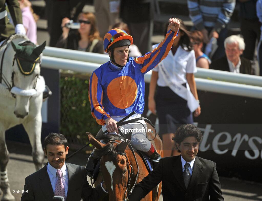 24 May 2009; Jockey Johnny Murtagh celebrates as he enters the parade ring after winning the Boylesports.com Irish 1,000 Guineas on Again. Boylesports.com Irish Guineas Festival 2009, Curragh Racecourse, Co. Kildare. Picture credit: Brian Lawless / SPORTSFILE