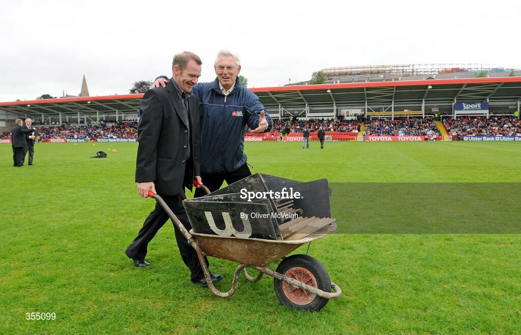 24 May 2009; Derry county public relations officer Sean Gunning wheels a barrow from the field, after the official opening ceremony of Celtic Parks new stand, assisted by  Seamus Mullan, Vice Chairman, Celtic Park development committe, Derry. Ulster GAA Football Senior Championship Quarter-Final, Derry v Monaghan, Celtic Park, Derry. Picture credit: Oliver McVeigh / SPORTSFILE