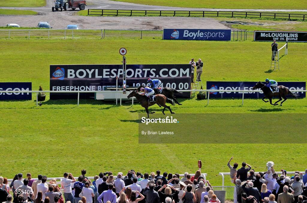 24 May 2009; Again, with Johnny Murtagh up, crosses the finishing post  ahead of 2nd place Lahaleeb, with Declan McDonogh up, and 3rd place Oh Goodness Me, Davy Moran up, on the way to winning the Boylesports.com Irish 1,000 Guineas, Group 1. Boylesports.com Irish Guineas Festival 2009, Curragh Racecourse, Co. Kildare. Picture credit: Brian Lawless / SPORTSFILE