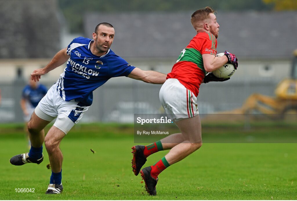 11 October 2015; Warren Kavanagh, Rathnew, in action against Darragh O'Sullivan, St Patrick's. Renault Ireland Wicklow County Senior Football Championship Final, Rathnew v St Patrick's. County Grounds, Aughrim, Co. Wicklow. Picture credit: Ray McManus / SPORTSFILE