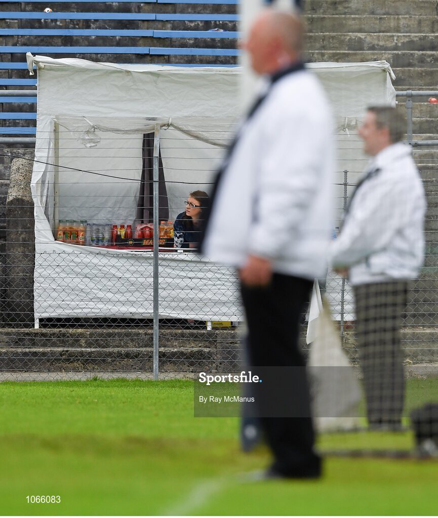 11 October 2015; Shopkeeper Tori Doyle and two of the game umpires watch on during the game. Renault Ireland Wicklow County Senior Football Championship Final, Rathnew v St Patrick's. County Grounds, Aughrim, Co. Wicklow. Picture credit: Ray McManus / SPORTSFILE