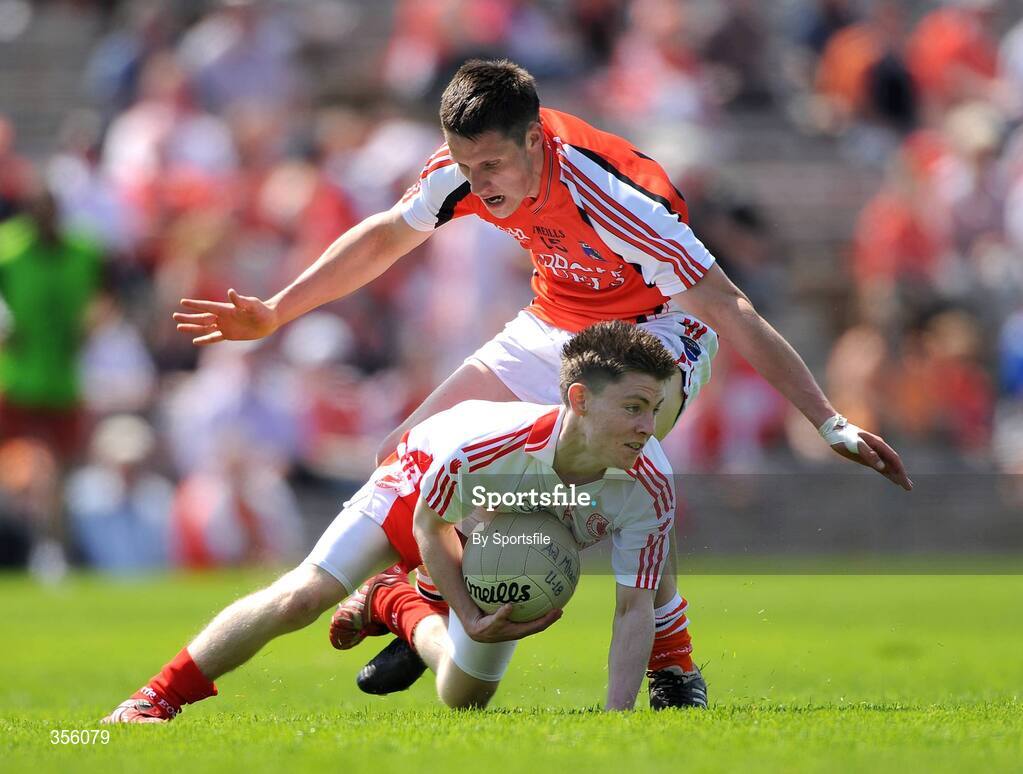 31 May 2009; Declan Connolly, Tyrone, in action against Gavin McParland, Armagh. Ulster GAA Football Minor Championship, Tyrone v Armagh, St. Tiernach's Park, Clones, Co.Monaghan. Photo by Sportsfile