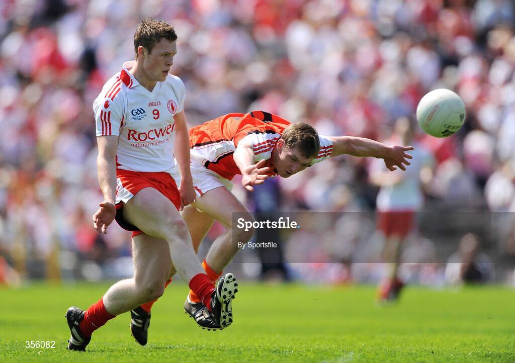 31 May 2009; Mark Faloon, Tyrone, in action against James Donnelly, Armagh. Ulster GAA Football Minor Championship, Tyrone v Armagh, St. Tiernach's Park, Clones, Co.Monaghan. Photo by Sportsfile