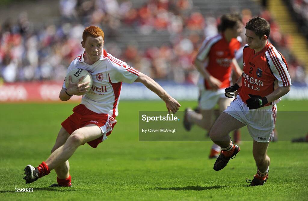31 May 2009; John McCullagh, Tyrone, in action against Kealan Downey, Armagh. Ulster GAA Football Minor Championship, Tyrone v Armagh, St. Tiernach's Park, Clones, Co.Monaghan. Picture credit: Oliver McVeigh / SPORTSFILE