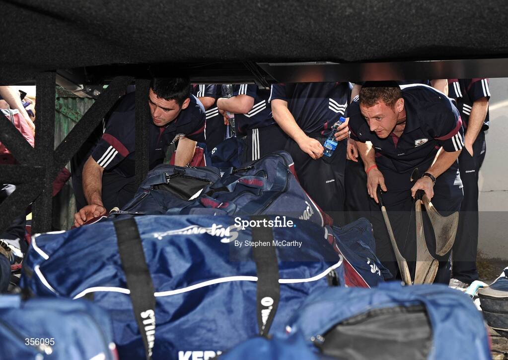 31 May 2009; Brian Costello, left, and Damien Joyce take their bags from the team bus as they make their way into O'Moore Park for their first game in the Leinster GAA Hurling Championship. Leinster GAA Hurling Senior Championship Quarter-Final, Laois v Galway, O'Moore Park, Portlaoise, Co. Laois. Picture credit: Stephen McCarthy / SPORTSFILE