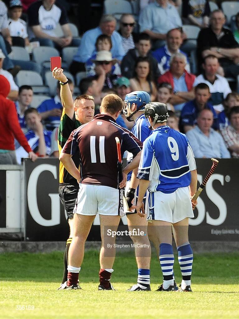 31 May 2009; Referee Brian Galvin, Offaly, issues a red card to both Kevin Hayes, Galway, no.11, and James Young, Laois, blue helmet. Leinster GAA Hurling Senior Championship Quarter-Final, Laois v Galway, O'Moore Park, Portlaoise, Co. Laois. Picture credit: Stephen McCarthy / SPORTSFILE