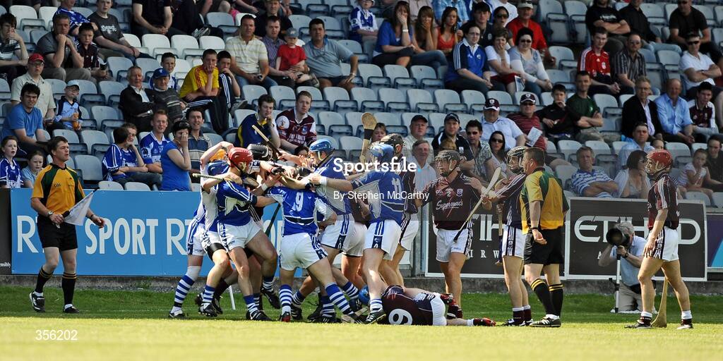 31 May 2009; Galway and Laois players tussle off the ball for which referee Brian Galvin, Offaly, issues a red card to both Kevin Hayes, Galway, and James Walsh, Laois. Leinster GAA Hurling Senior Championship Quarter-Final, Laois v Galway, O'Moore Park, Portlaoise, Co. Laois. Picture credit: Stephen McCarthy / SPORTSFILE