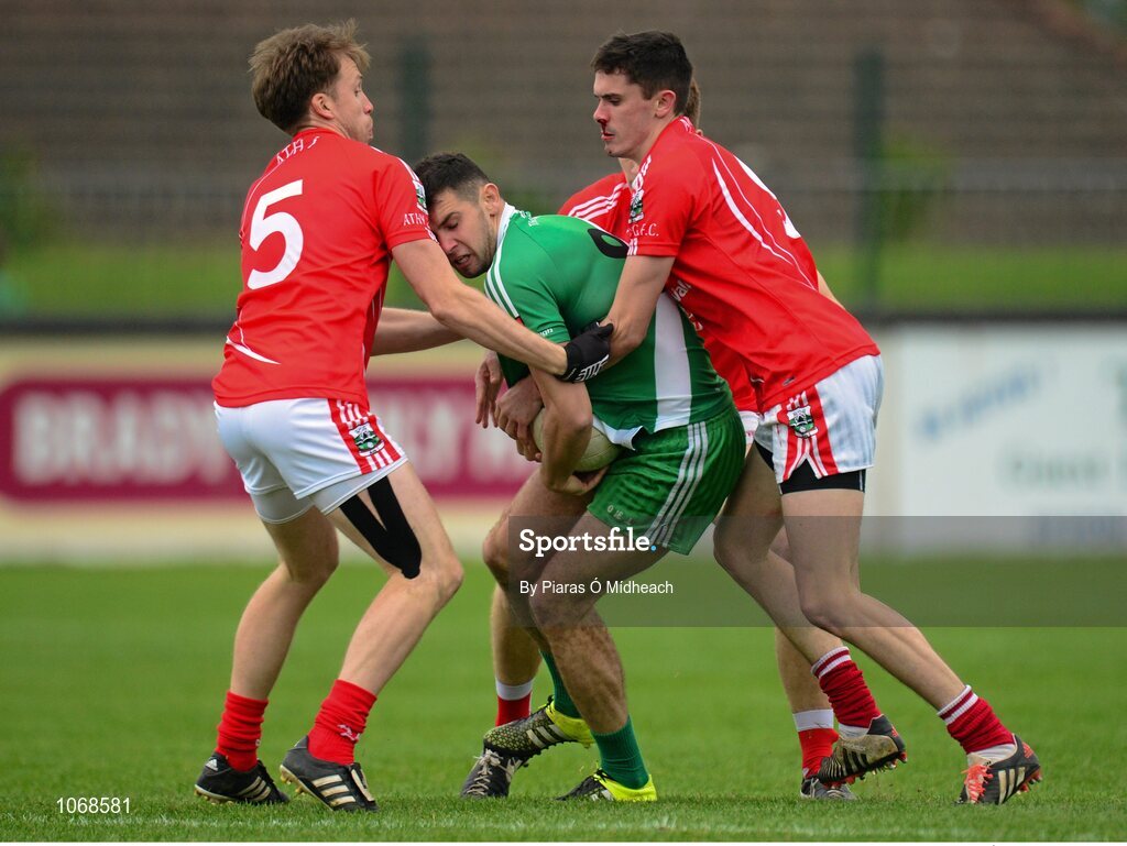 18 October 2015; Matty Byrne, Sarsfields, in action against Athy's, from left, Ross Bell, Kevin Feely, and David Hyland. Kildare County Senior Football Championship Final, Athy v Sarsfields. St Conleth's Park, Newbridge, Co. Kildare. Picture credit: Piaras Ó Mídheach / SPORTSFILE