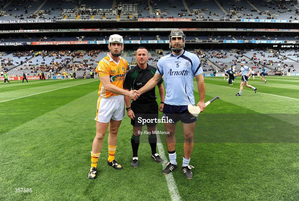 7 June 2009; The Dublin captain Stephen Hiney and the Antrim captain Neil McGarry shake hands across match referee James McGrath. Leinster GAA Hurling Senior Championship First Round, Dublin v Antrim, Croke Park, Dublin. Picture credit: Ray McManus / SPORTSFILE