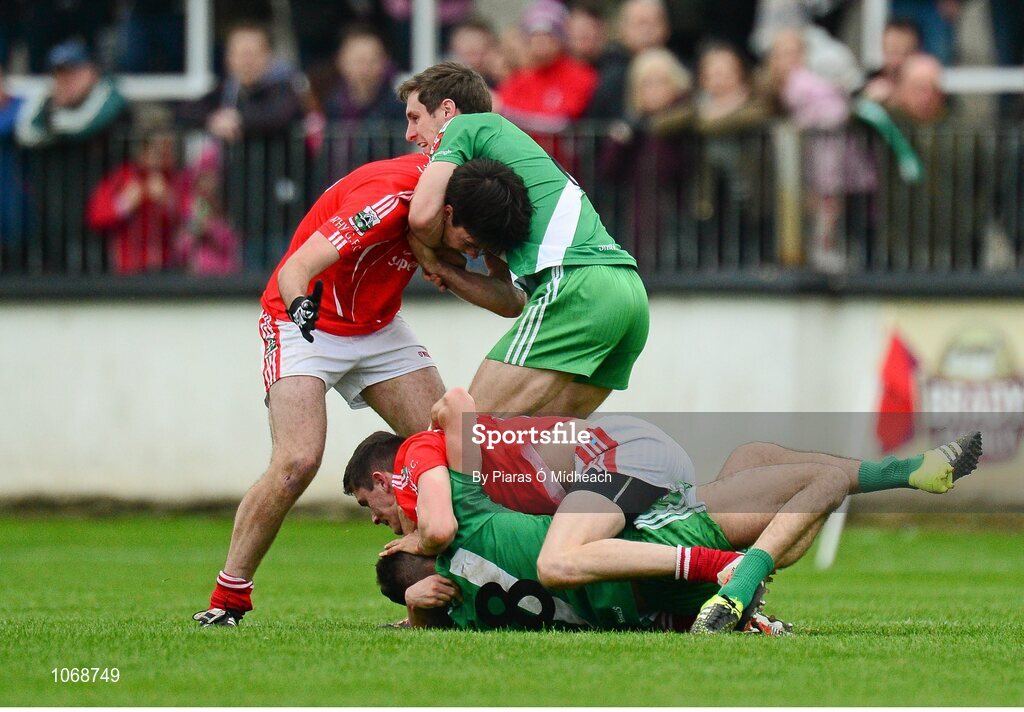 18 October 2015; Sarsfields Matty Byrne, bottom, and Gary White tussles with Athy's David Hyland, bottom, and David McGovern. Kildare County Senior Football Championship Final, Athy v Sarsfields. St Conleth's Park, Newbridge, Co. Kildare. Picture credit: Piaras Ó Mídheach / SPORTSFILE