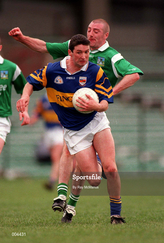 10 May 1998; Brendan Cummins of Tipperary in action against Martin Dineen of Limerick during the Munster GAA Football Senior Championship First Round match between Limerick and Tipperary at Gaelic Grounds in Limerick. Photo by Ray McManus/Sportsfile