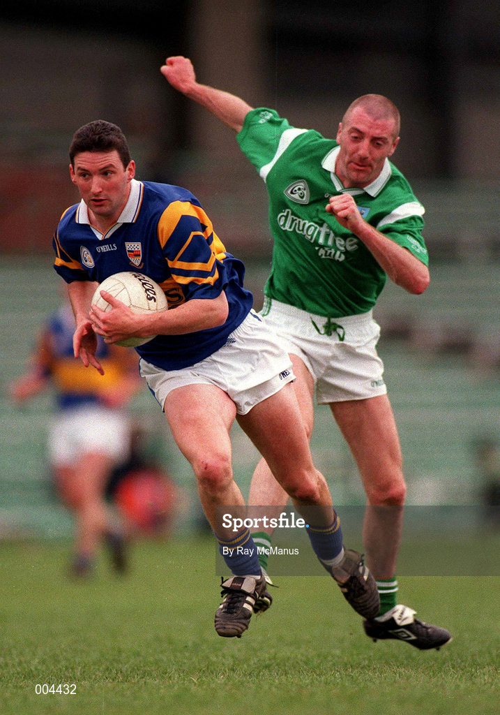 10 May 1998; Brendan Cummins of Tipperary in action against Martin Dineen of Limerick during the Munster GAA Football Senior Championship First Round match between Limerick and Tipperary at Gaelic Grounds in Limerick. Photo by Ray McManus/Sportsfile