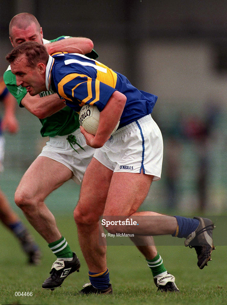 10 May 1998; Brian Burke of Tipperary in action against Martin Dineen of Limerick during the Munster GAA Football Senior Championship First Round match between Limerick and Tipperary at Gaelic Grounds in Limerick. Photo by Ray McManus/Sportsfile