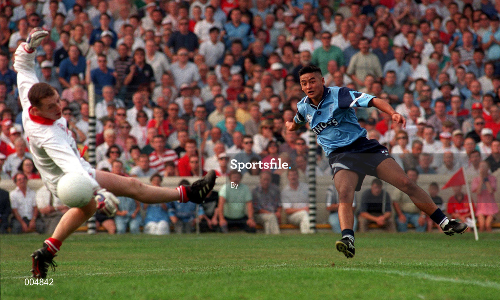 20 August 1995. Dublin's Jason Sherlock blasts the ball past Cork goalkeeper Kevin O'Dwyer for his side's goal. All-Ireland Football semi-final, Cork v Dublin, Croke Park. Picture Credit: David Maher SPORTSFILE.