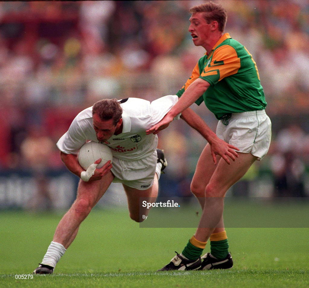 3 August 1997. Kildare's Willie McCreery holds off Meath's Trevor Giles. Meath v Kildare. Leinster Football Championship Semi Final 1st replay, Croke Park, Dublin. Picture Credit: Ray McManus/SPORTSFILE