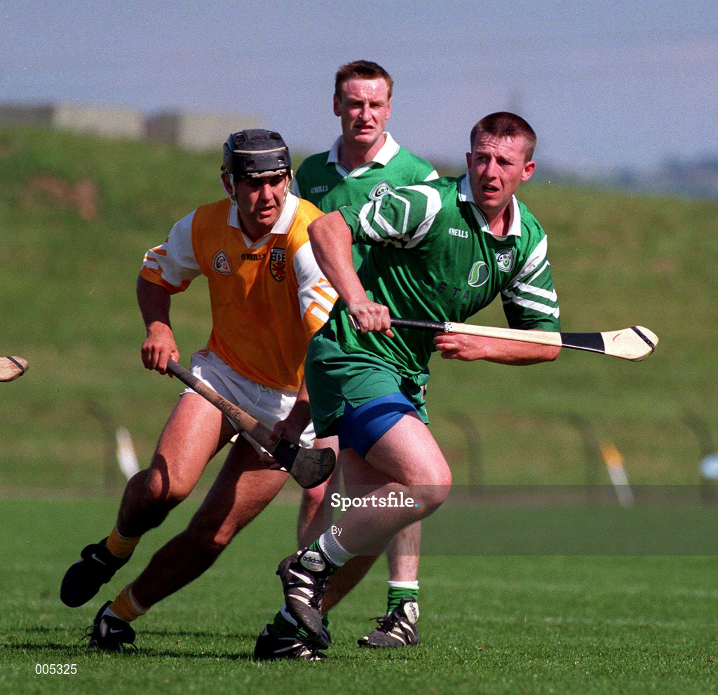 14 June 1998. London's Timmy Maloney in action against Antrim's John Carson. Ulster Hurling Championship, Antrim v London, Casement Park, Belfast. Picture Credit: Damien Eagers/SPORTSFILE.