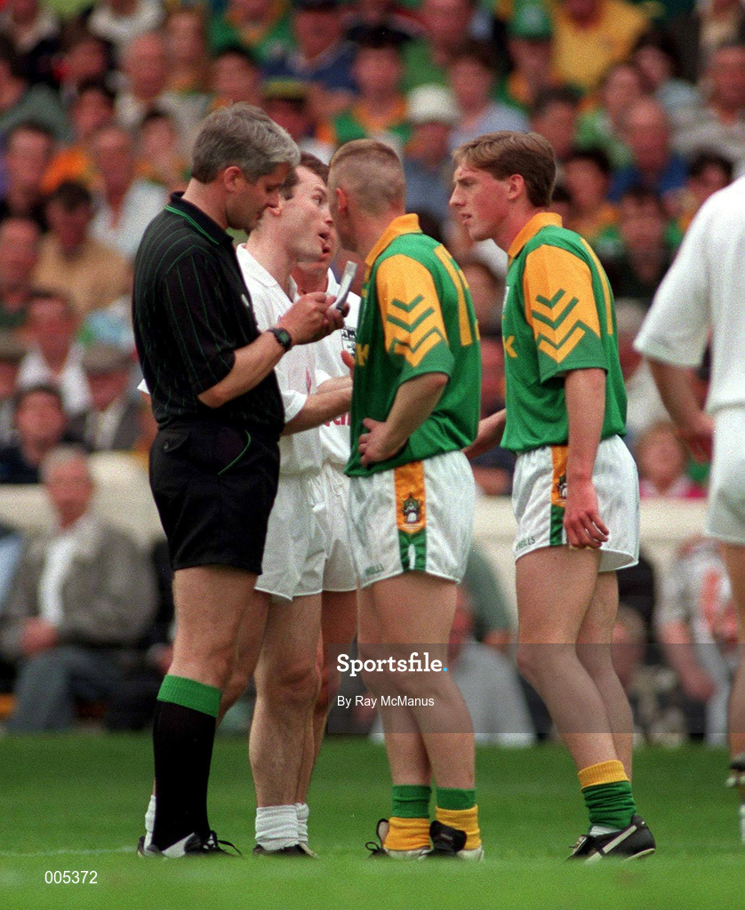 2 August 1998; Tommy Dowd of Meath is booked by referee John Bannon during the Leinster Senior Football Championship Final match between Kildare and Meath at Croke Park in Dublin. Picture credit: Ray McManus/Sportsfile