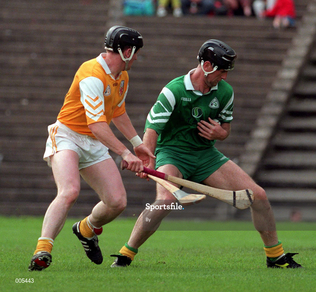 21 June 1998. London's Willie Lohan holds off the challenge of Antrim's Gregory O'Kane. Antrim v London, Ulster Hurling Championship, Casement Park, Belfast. Picture Credit: Damien Eagers/SPORTSFILE.