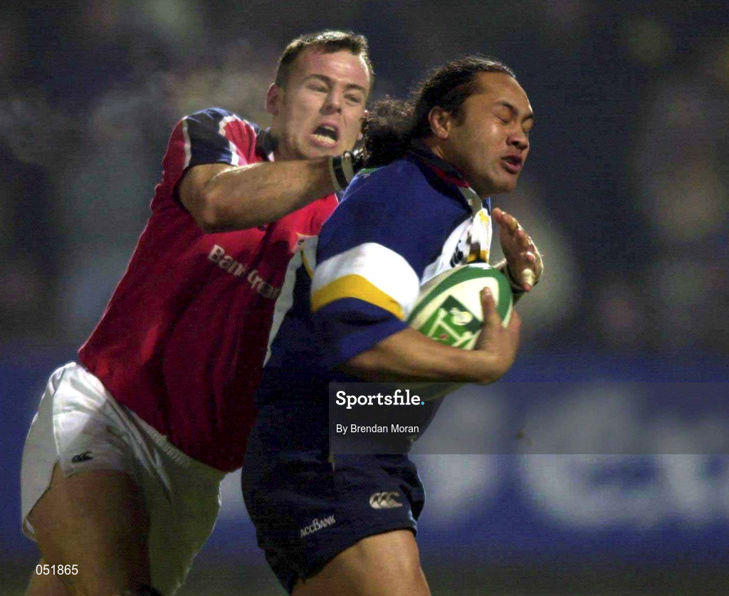 5 January 2001; Eddie Hekenui of Leinster is tackled by John O'Neill of Munster during the Interprovincial friendly match between Munster and Leinster at Musgrave Park in Cork. Photo by Brendan Moran/Sportsfile