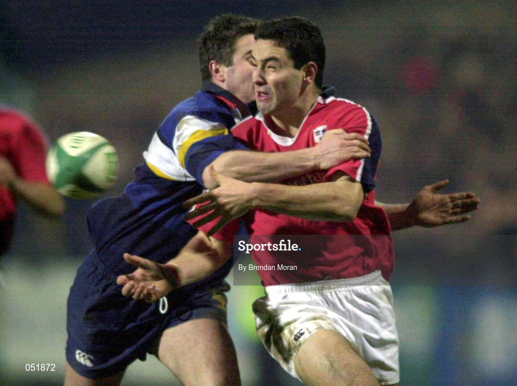 5 January 2001; Jeremy Staunton of Munster offloads as he is tackled by Peter McKenna of Leinster during the Interprovincial friendly match between Munster and Leinster at Musgrave Park in Cork. Photo by Brendan Moran/Sportsfile