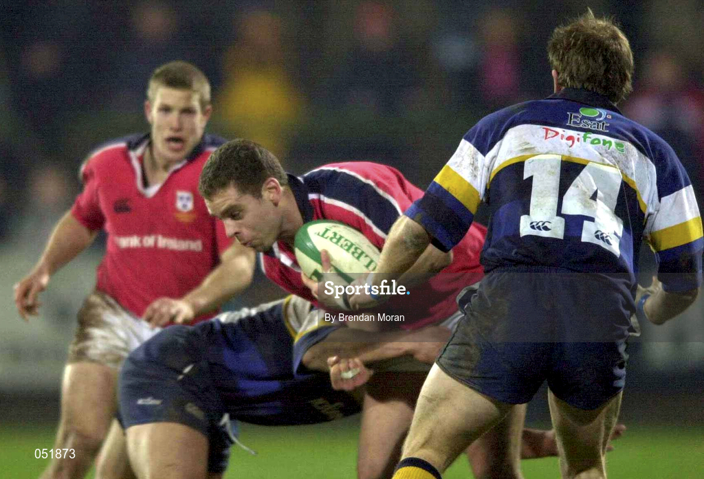 5 January 2001; Dominic Crotty of Munster is tackled by Eddie Hekenui, left, and Denis Hickie of Leinster during the Interprovincial friendly match between Munster and Leinster at Musgrave Park in Cork. Photo by Brendan Moran/Sportsfile