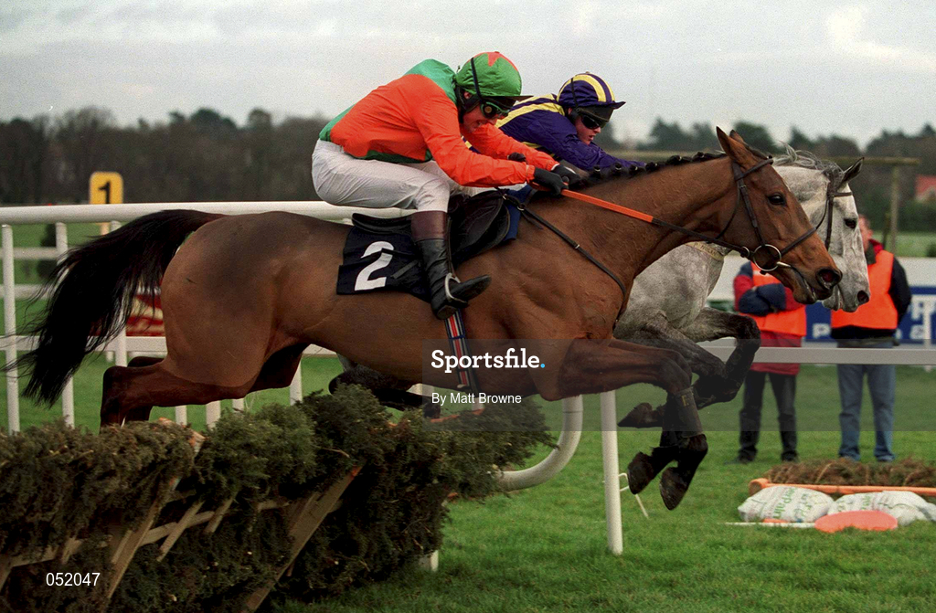 23 January 2000; Boss Doyle, with Charlie Swan up, jumps the last ahead of Gentle Mossy, with Joey Elliott up, to win the Ashford Handicap Hurdle at Leopardstown Racecourse in Dublin. Photo by Matt Browne/Sportsfile