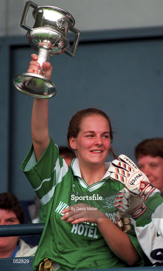 25 September 1998; The London Ladies Captain lifts the Cup following the Irish Holidays International Football Festival match between London and North American Board  at Parnell Park, Dublin. Photo by David Maher/Sportsfile