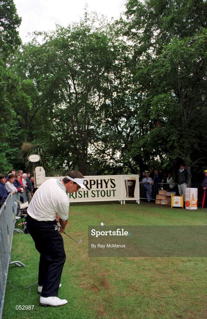 5 July 1997; Gary Murphy of Ireland plays a shot to the 6th green from the 4th tee box, he cleared the trees and advertising hoarding to land beside the pin during the third round of the Murphy's Irish Open Golf Championship at Druid's Glen in Wicklow. Photo by Ray McManus/Sportsfile