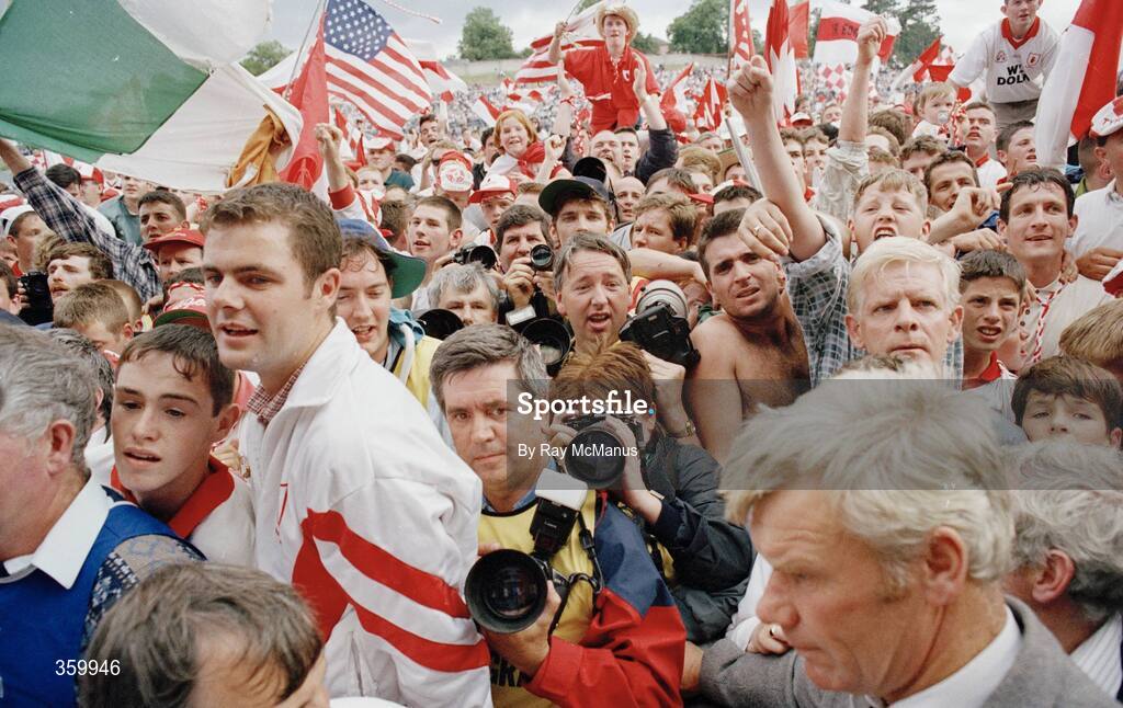 23 July 1995; Players, officials and media stuggle after supporters invaded the the pitch following Tyrone's 2-13 to 0-7 victory over Cavan. Ulster Senior Football Championship Final, Tyrone v Cavan, St. Tighearnach's Park, Clones, Co. Monaghan. Picture credit: Ray McManus / SPORTSFILE