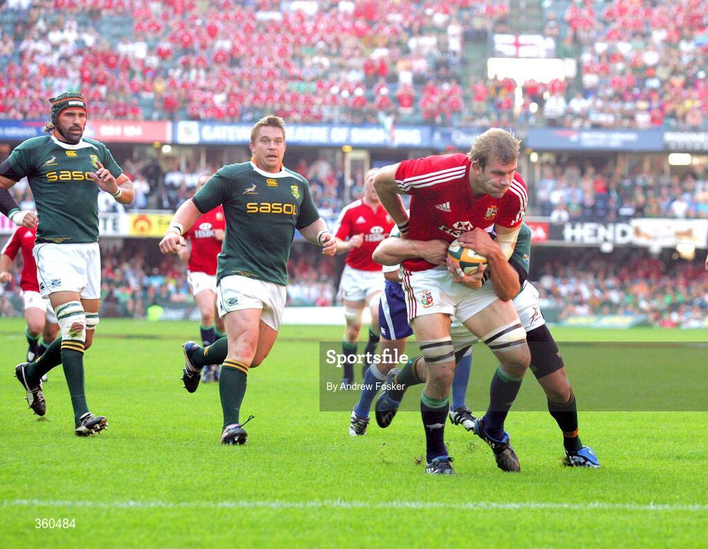 20 June 2009; Tom Croft, British and Irish Lions, drives through Frans Steyn's tackle to score the Lions' first test try of the series. Watching on are John Smit and Victor Matfield, left, South Africa. 1st Test, South Africa v British and Irish Lions, ABSA Stadium, Durban, South Africa. Picture credit: Andrew Fosker / SPORTSFILE
