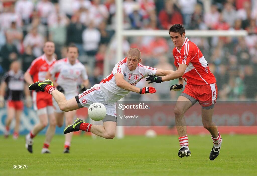 21 June 2009; Kevin Hughes, Tyrone, in action against Chrissy McKaigue, Derry. GAA Football Ulster Senior Championship Semi-Final, Tyrone v Derry, Casement Park, Belfast, Co. Antrim. Photo by Sportsfile