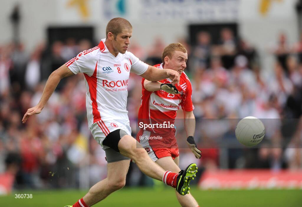21 June 2009; Kevin Hughes, Tyrone, in action against Gavin McShane, Derry. GAA Football Ulster Senior Championship Semi-Final, Tyrone v Derry, Casement Park, Belfast, Co. Antrim. Photo by Sportsfile
