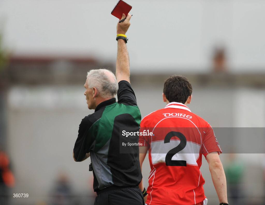 21 June 2009; Derry's Kevin McGuckin is shown the red card by referee Gearoid O Conamha. GAA Football Ulster Senior Championship Semi-Final, Tyrone v Derry, Casement Park, Belfast, Co. Antrim. Photo by Sportsfile