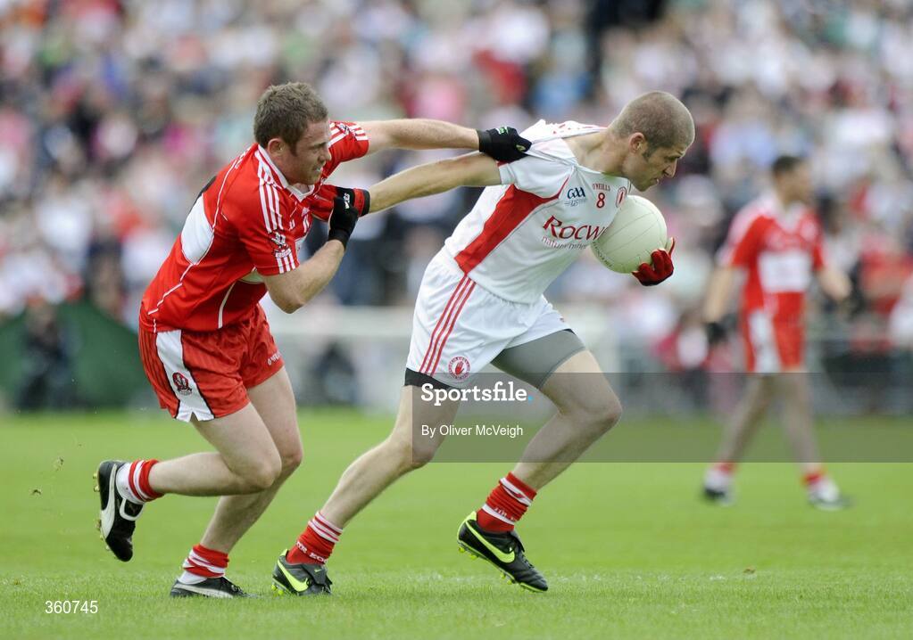 21 June 2009; Kevin Hughes, Tyrone, in action against Paul Murphy, Derry. GAA Football Ulster Senior Championship Semi-Final, Tyrone v Derry, Casement Park, Belfast, Co. Antrim. Picture credit: Oliver McVeigh / SPORTSFILE