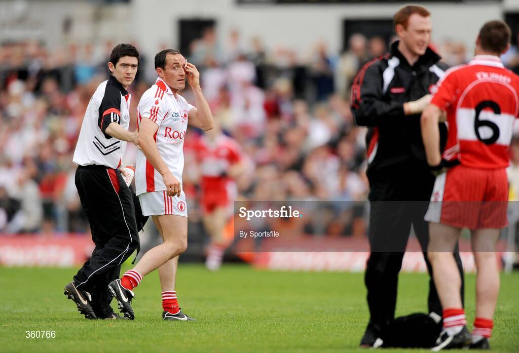 21 June 2009; Brian Dooher, Tyrone, looks over to Barry McGuigan, Derry, as he is taken off as a blood substitute, having previously been involved in an incident with him. GAA Football Ulster Senior Championship Semi-Final, Tyrone v Derry, Casement Park, Belfast, Co. Antrim. Photo by Sportsfile