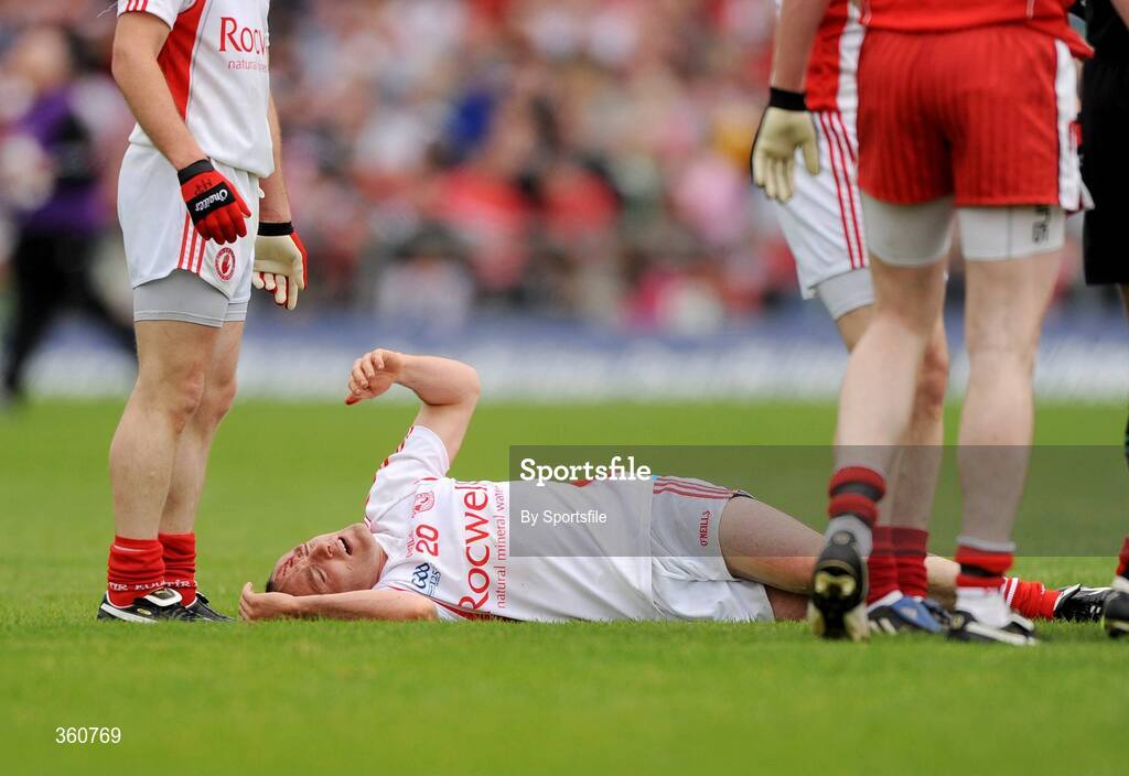 21 June 2009; Brian Dooher, Tyrone, lies on the ground after being involved in an incident with Barry McGuigan, Derry. GAA Football Ulster Senior Championship Semi-Final, Tyrone v Derry, Casement Park, Belfast, Co. Antrim. Photo by Sportsfile