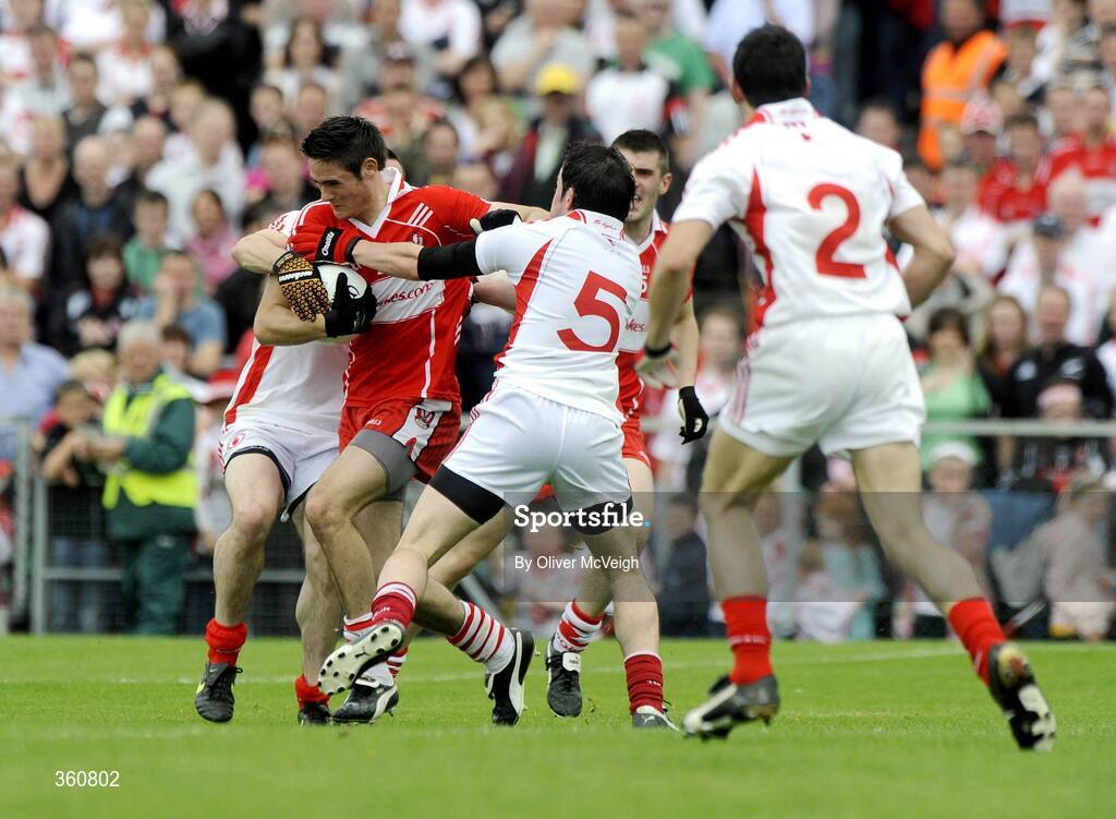 21 June 2009; Chrissy McKaigue, Derry, in action against Philip Jordan and Davy Harte, Tyrone. GAA Football Ulster Senior Championship Semi-Final, Tyrone v Derry, Casement Park, Belfast, Co. Antrim. Picture credit: Oliver McVeigh / SPORTSFILE