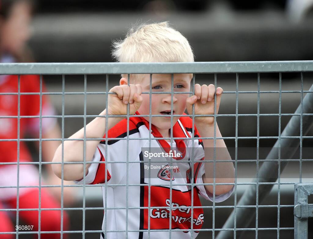 21 June 2009; Derry supporter Patrick Harley-Moyes, aged five, from Portstewart, Co. Derry, watches on during the game. GAA Football Ulster Senior Championship Semi-Final, Tyrone v Derry, Casement Park, Belfast, Co. Antrim. Picture credit: Daire Brennan / SPORTSFILE