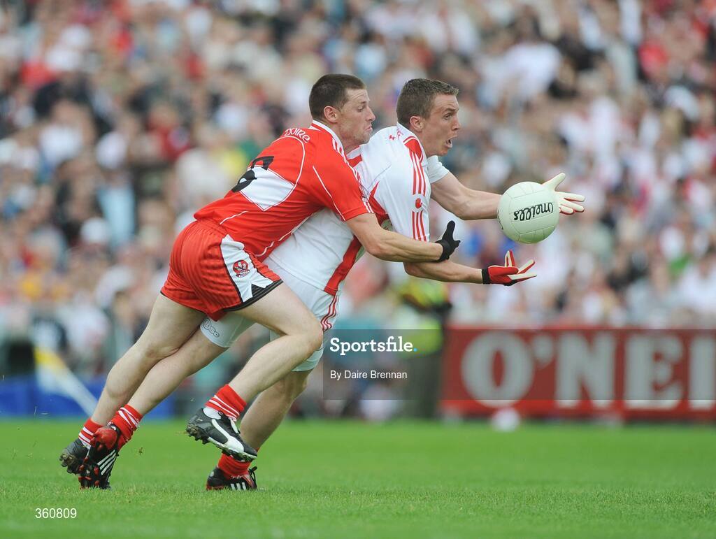 21 June 2009; Tommy McGuigan, Tyrone, in action against Barry McGuigan, Derry. GAA Football Ulster Senior Championship Semi-Final, Tyrone v Derry, Casement Park, Belfast, Co. Antrim. Picture credit: Daire Brennan / SPORTSFILE
