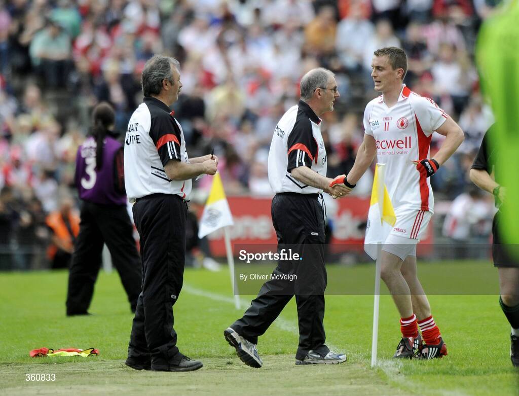 21 June 2009; Tyrone manager, Mickey Harte, shakes hands with Tommy McGuigan after coming off in the second half. GAA Football Ulster Senior Championship Semi-Final, Tyrone v Derry, Casement Park, Belfast, Co. Antrim. Picture credit: Oliver McVeigh / SPORTSFILE