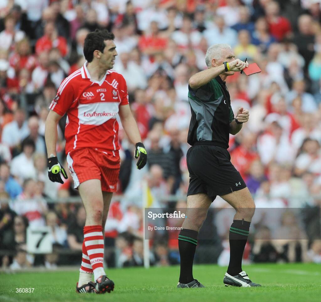 21 June 2009; Referee Gearoid O Conamha shows Kevin McGuckin, Derry, a red card during the game. GAA Football Ulster Senior Championship Semi-Final, Tyrone v Derry, Casement Park, Belfast, Co. Antrim. Picture credit: Daire Brennan / SPORTSFILE