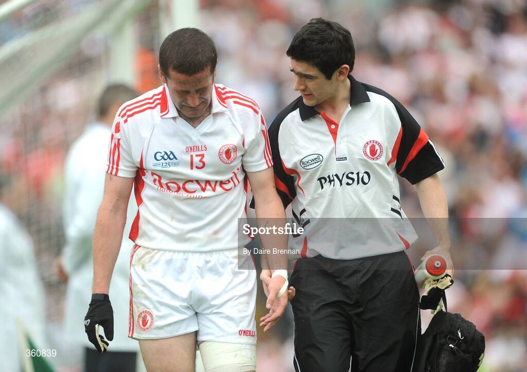 21 June 2009; Tyrone physio Michael Harte walks off the pitch with Stephen O'Neill, Tyrone. GAA Football Ulster Senior Championship Semi-Final, Tyrone v Derry, Casement Park, Belfast, Co. Antrim. Picture credit: Daire Brennan / SPORTSFILE
