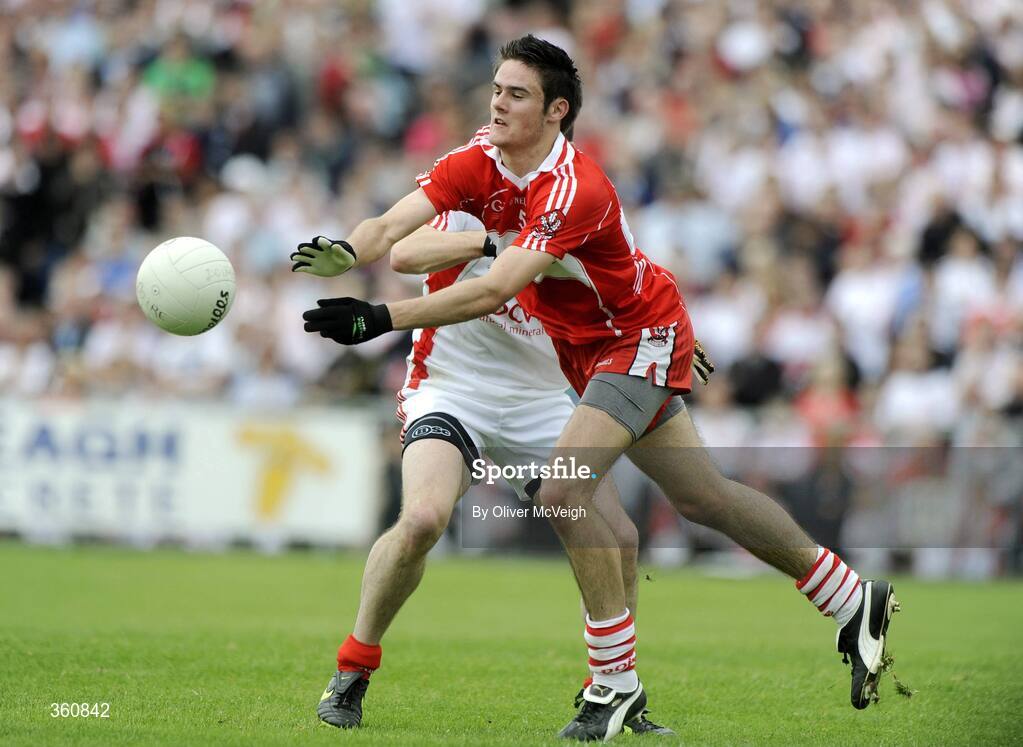 21 June 2009; Chrissy McCaigue, Derry, in action against Ryan McMenamin, Tyrone. GAA Football Ulster Senior Championship Semi-Final, Tyrone v Derry, Casement Park, Belfast, Co. Antrim. Picture credit: Oliver McVeigh / SPORTSFILE