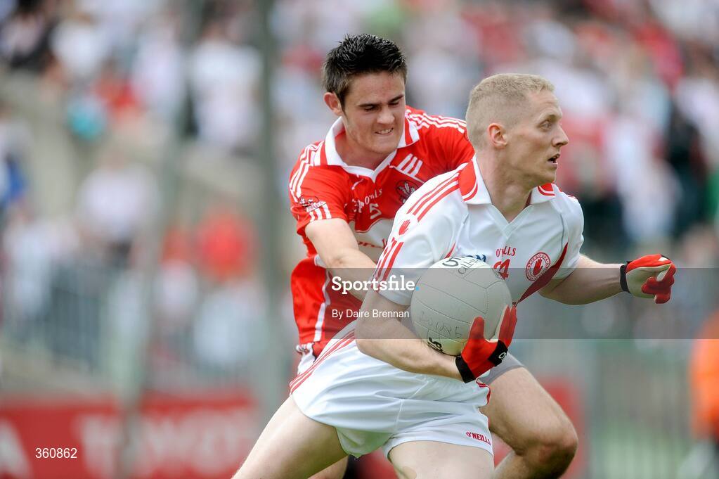 21 June 2009; Colm McCullagh, Tyrone, in action against Chrissy McKaigue, Derry. GAA Football Ulster Senior Championship Semi-Final, Tyrone v Derry, Casement Park, Belfast, Co. Antrim. Picture credit: Daire Brennan / SPORTSFILE