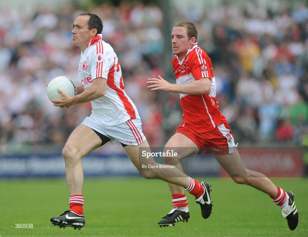 21 June 2009; Brian Dooher, Tyrone, in action against Sean Leo McGoldrick, Derry. GAA Football Ulster Senior Championship Semi-Final, Tyrone v Derry, Casement Park, Belfast, Co. Antrim. Picture credit: Daire Brennan / SPORTSFILE