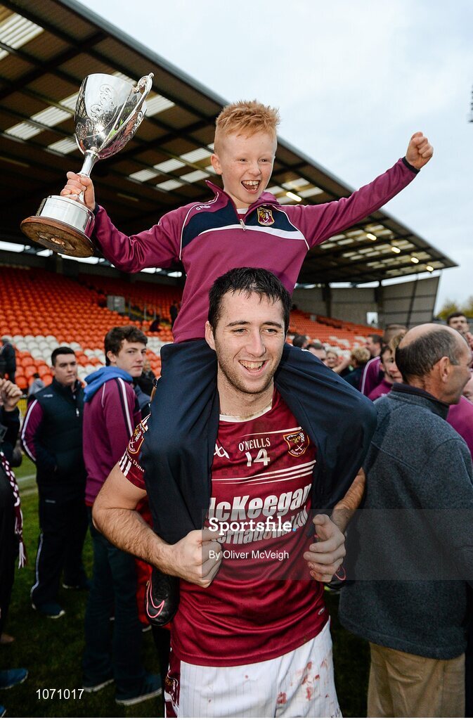 25 October 2015; Sean McAfee, Cushendall, along with young supporter Aidan Cambell celebrate after the game. AIB GAA Hurling Ulster GAA Senior Club Championship Final, Cushendall v Slaughtneil Ruairí Óg. Athletic Grounds, Armagh. Picture credit: Oliver McVeigh / SPORTSFILE